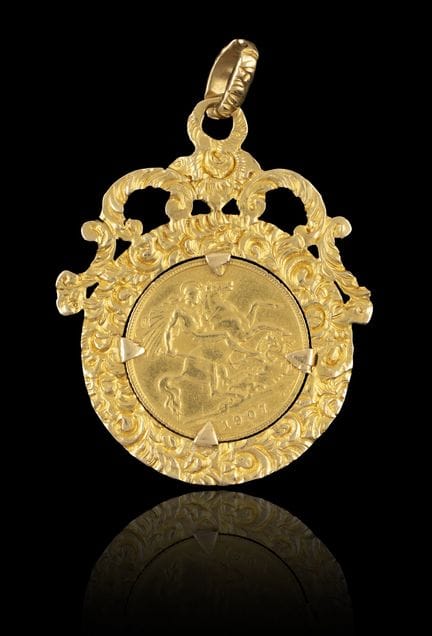 Colgante de oro tipo «sovereign»
Montura de oro, l