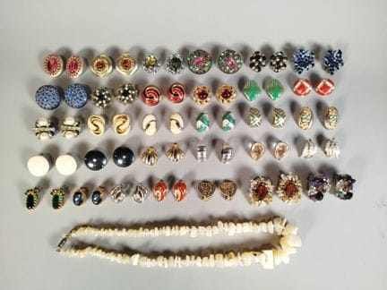 A collection of thirty-one pairs of clip-on earrin
