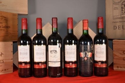 A collection of six bottles of Bordeaux, including