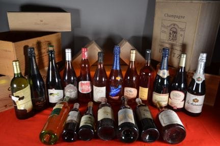 A collection of seventeen bottles and two half-bot