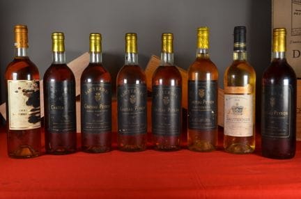 A collection of eight bottles of sweet white wine,