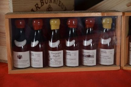 A set of four wooden boxes with transparent fronts