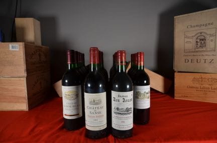 A collection of twenty-four bottles of Bordeaux Su