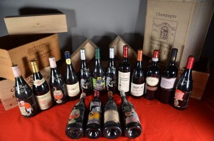 A collection of sixteen bottles of assorted red wi