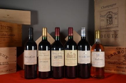 A set of six bottles of wine, including: Mouton Ca