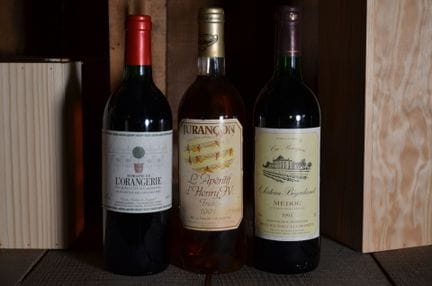 A set of three bottles including a red wine from D