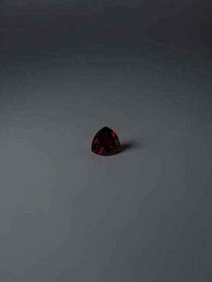 5.9 mm trillion-cut garnet, approximately 0.95 car