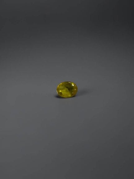 Oval rose-cut yellow sapphire, 7.7 × 6 mm, approxi
