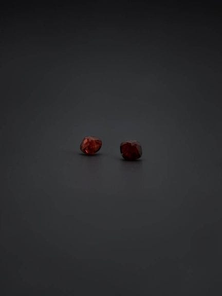 Two cushion-cut garnets, approximately 1.27 carats