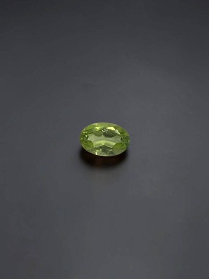 Oval peridot, 6 × 4 mm, approximately 0.54 carats