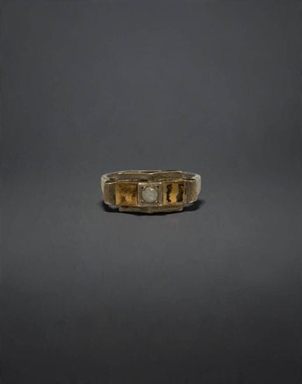 Silver ring (800/1000) set with a small white ston