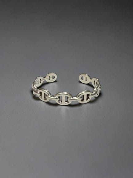 HERMÈS
Bracciale rigido con catena ad ancora in ar