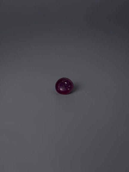 Star ruby cabochon, 6.1 × 5.5 mm, approximately 1.