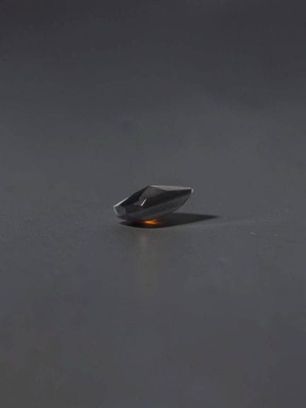 Fancy-cut garnet, 6.1 × 4.8 mm, approximately 0.64