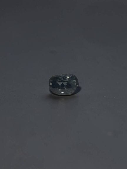 Oval blue-gray spinel, 6.8 × 4.9 mm, approximately