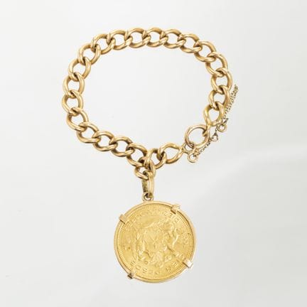 18K yellow gold link bracelet featuring a 100-peso
