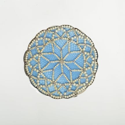 Art Deco pendant brooch in platinum on a sky-blue 