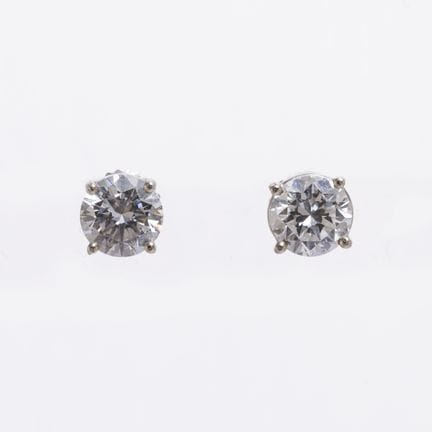 A pair of 18K white gold screw-set earrings, each 