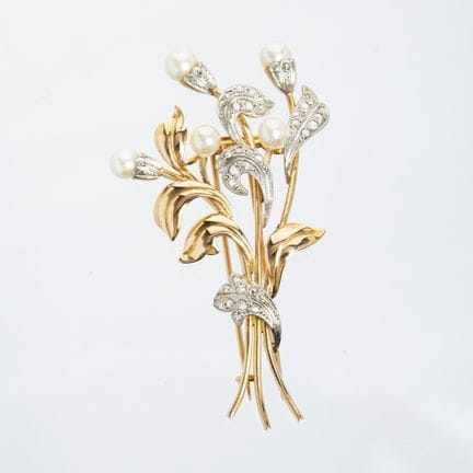 18K yellow gold brooch with a "leaves and flowers"
