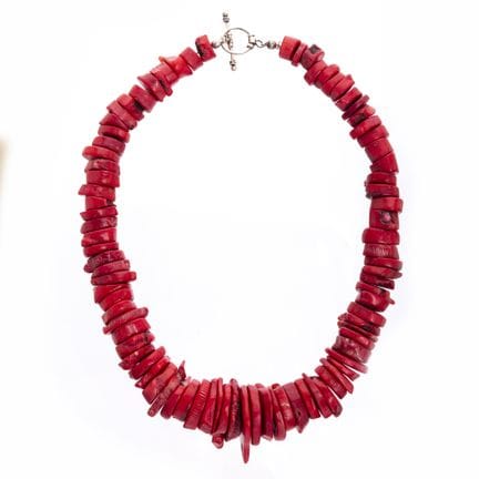 Necklace made of coral slices with a silver clasp.