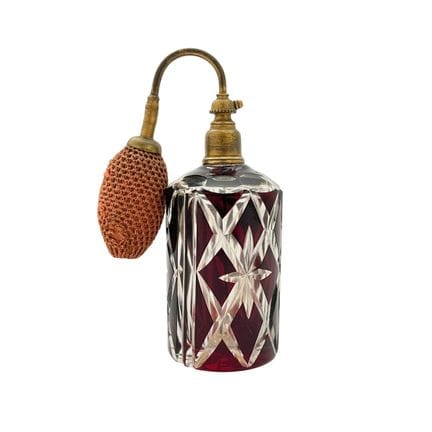 Flacon de parfum en cristal taillé de couleur bord