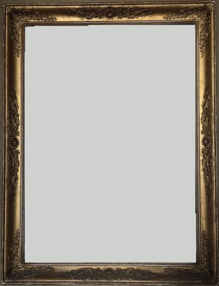 Wooden mirror with gilded stucco and scrollwork de