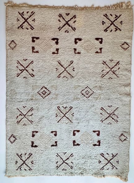 Rug with chocolate-colored geometric patterns on a