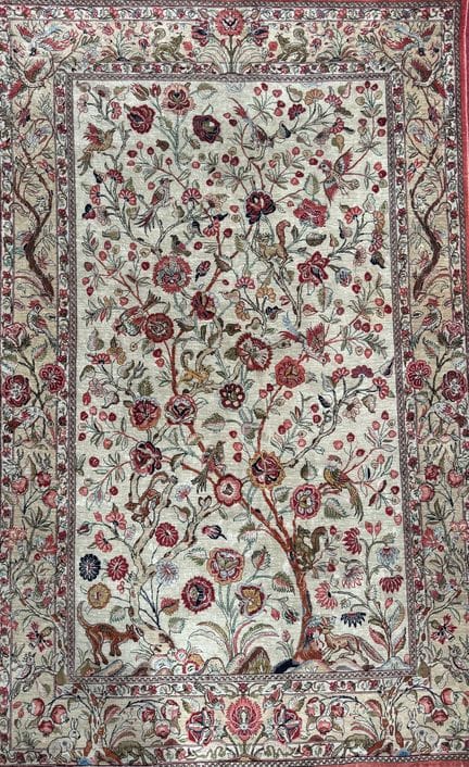 Ghoum (Iran) silk carpet featuring a design of per