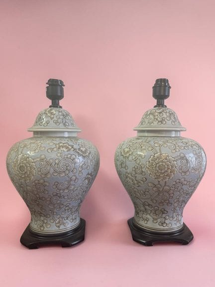 Pair of porcelain lamp bases with scrollwork and s