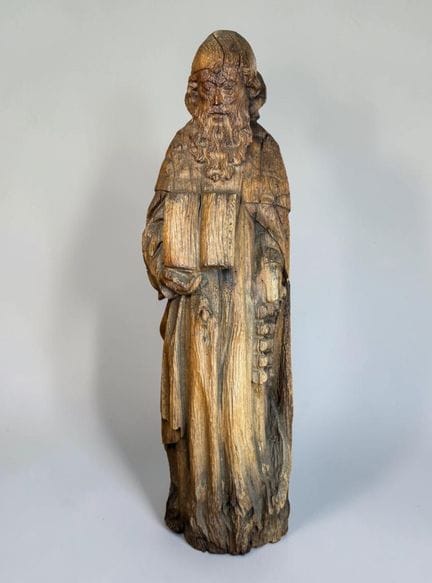 Carved wooden Saint Anthony, with a roughly shaped