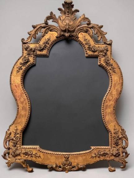 Curved mirror made of stuccoed and gilded wood, de