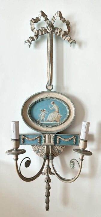 Pair of wall sconces with two light arms, partly m
