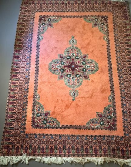 Moroccan wool rug with a geometric pattern on a sa