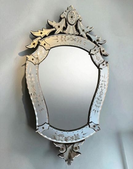 Venetian mirror in a violin shape, decorated with 