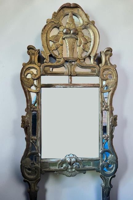Mirror with gilded wooden frame, carved with a bas