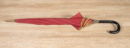 CHRISTIAN DIOR 
Red canvas umbrella embellished wi