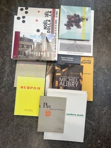 A large collection of artists' catalogs, including