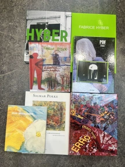 A large collection of books, including six monogra