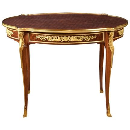 ADAM WEISWEILER
OVAL MAHOGANY AND GILT-BRONZE OCCA