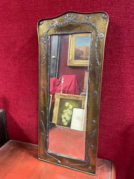 Rectangular mirror with a gold and silver plated m