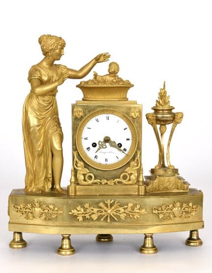Reloj de época Imperio, hacia 1805. Bronce dorado.