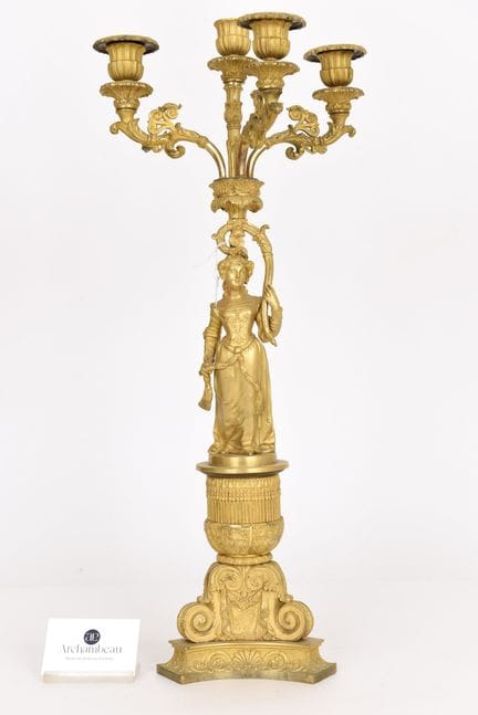 Candelabro de bronce dorado.
Época de Carlos X. 
F