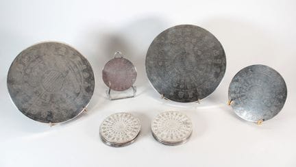 CHRISTOFLE - Set of two trivets, two bottle coaste