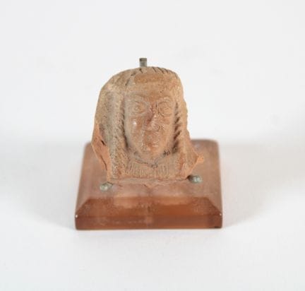 Fragment of a votive statuette (Isis).
Terracotta,