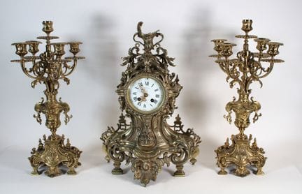 A chiseled and gilded bronze mantelpiece set with 