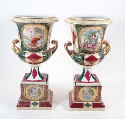 Pair of Medici vases resting on a square-section b