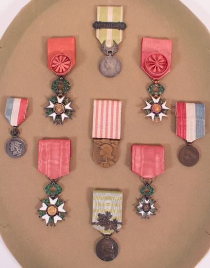 A frame containing four Legions of Honor and vario