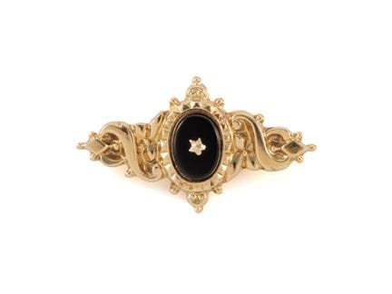 Broche originale en or jaune 585 avec onyx

Broche