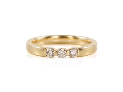 Bague en or jaune 585 sertie de 3 brillants

Bague