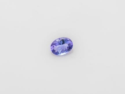Tanzanite taille ovale de 1.52 ct sur papier. Dime